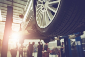Mechanic repairing a car that is covered by a motor plan or motor warranty.